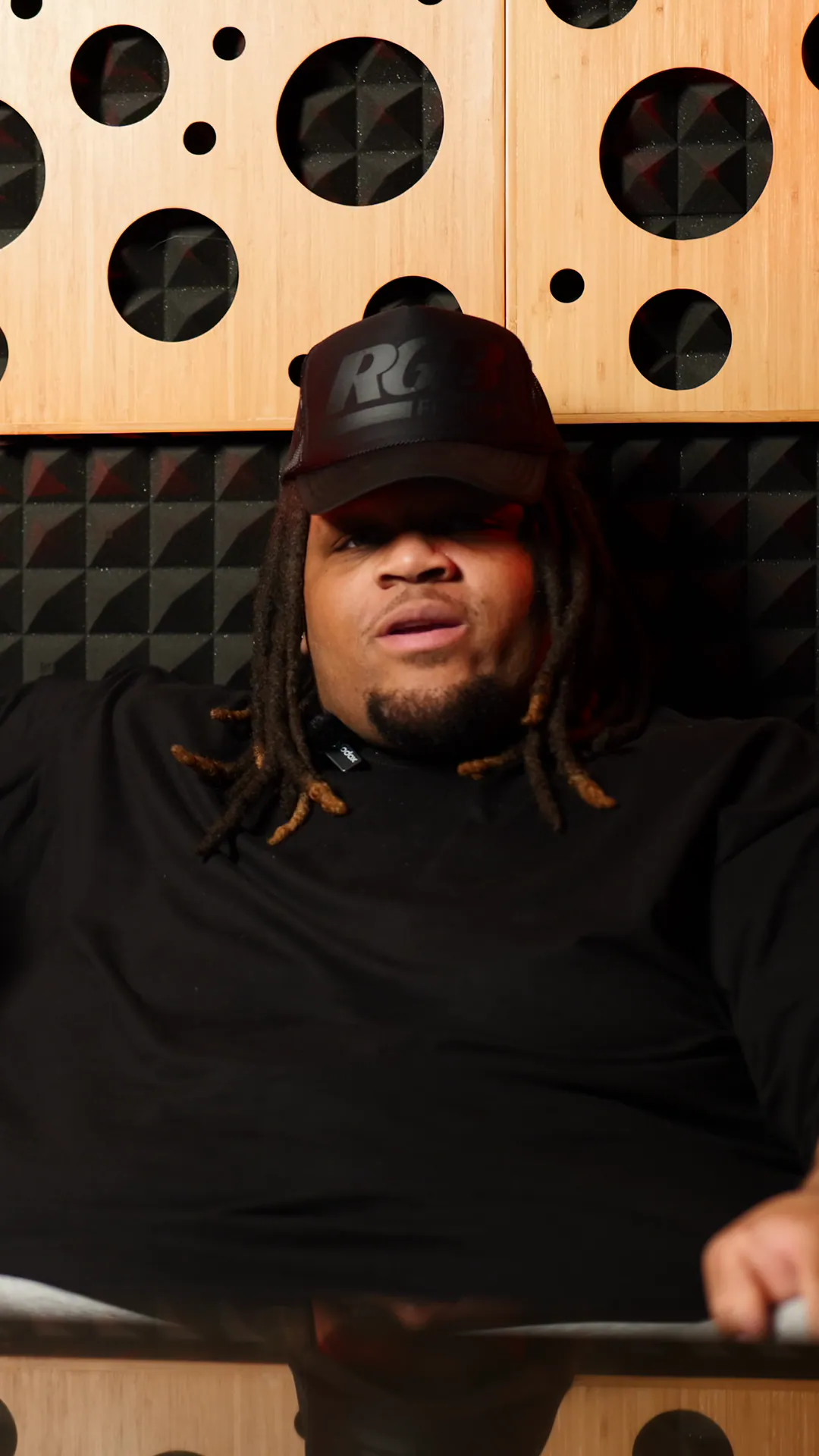 Adorii on the studio couch in the Get to Know Your Favorite Artist series.