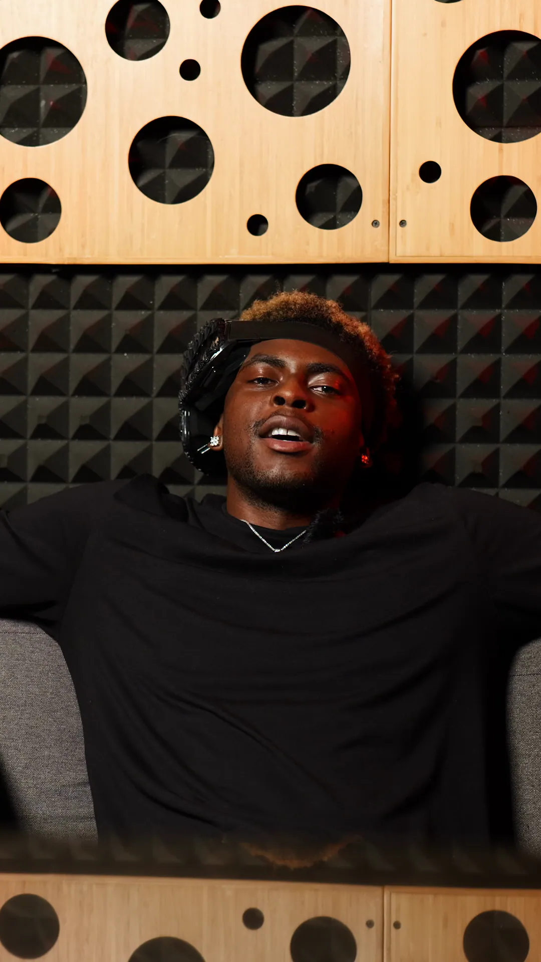JUUVA on the studio couch in the Get to Know Your Favorite Artist series.